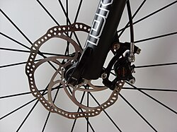 A front disc brake, mounted to the fork and hub