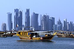 Traditional dhows in front of the West Bay skyline as seen from the Doha Corniche
