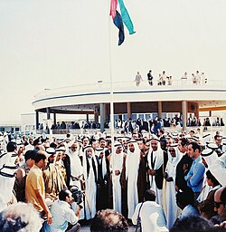 Historic photo depicting the first hoisting of the United Arab Emirates flag by the rulers of the emirates at the Union House in Dubai on 2 December 1971