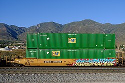 53 foot EMP containers in a well car