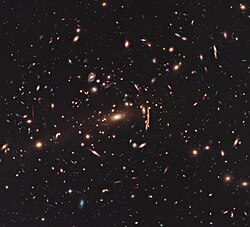 This image from the NASA/ESA Hubble Space Telescope shows the galaxy cluster MACS J1206.