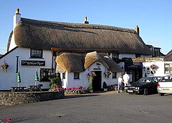 A thatched pub (The Williams Arms) at Wrafton, North Devon, England