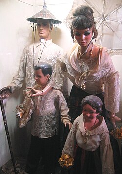 Typical costume of a family belonging to the Principalía of the late 19th century Philippines. Exhibit in the Villa Escudero Museum, San Pablo, Laguna.
