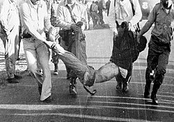 A fallen victim of the massacre being carried.