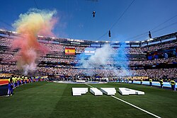 Smoke in the national colors of Spain and Argentina drifts across MetLife Stadium's pitch minutes before kickoff.