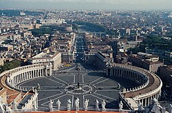 St. Peter's Square is located directly in front of St. Peter's Basilica in Vatican City.