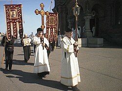 Russian Orthodox Crucession with lantern, processional cross and Khorugvi (banners).