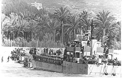 Israeli armored vehicles disembark from a landing craft during an amphibious landing