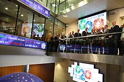 Stock exchanges, characteristic features of the top global cities, are interconnected hubs for capital. Here, a delegation from Australia visits the London Stock Exchange.