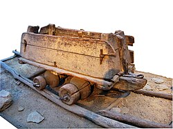 A 16th-century mine-cart, an early example of un-powered rail transport, used man power to operate.