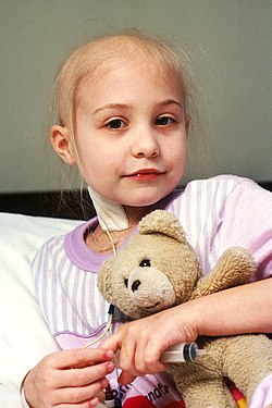 Young girl receiving chemotherapy treatment