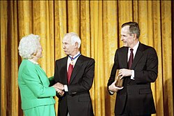 Carson being awarded the Presidential Medal of Freedom by President George H. W. Bush and First Lady Barbara Bush in 1992