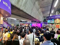 A crowded BTS Station during the rush hour in Bangkok, Thailand
