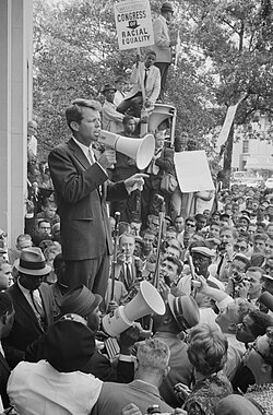 Attorney General Robert F. Kennedy speaking before a hostile civil rights crowd protesting low minority hiring in his Justice Department, June 14, 1963[252]