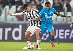 Dybala (left) in action for Juventus in 2021