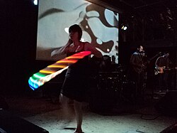 A retro example of psychedelia; the dancer combines 1960s fashion with modern LED lighting.