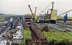 Turf-cutting near Maam Cross by the road to Leenane, County Galway