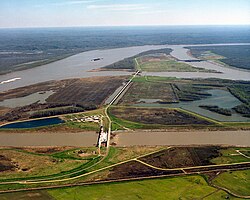 The Old River Control Structure complex. View is to the east-southeast, looking downriver on the Mississippi, with the three dams across channels of the Atchafalaya River to the right of the Mississippi. Concordia Parish, Louisiana is in the foreground, on the right, and Wilkinson County, Mississippi, is in the background, across the Mississippi on the left.