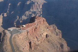 Aerial view of Guano Point. Old tramway headhouse is at the end of dirt road (right). Second tramway tower is more clearly visible, on skyline to right. Bat Cave mine is 760 m (2,500 ft) below, across the canyon.
