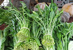 Bunches of dandelion greens at a farmer's market