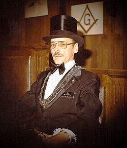 Masonic Worshipful Master Bill Edgerton wearing his traditional top hat[when?]