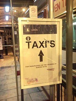 Sign at Leeds railway station, England, with an ex­tra­ne­ous apos­tro­phe crossed out
