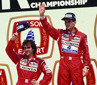 Alain Prost (left) and Ayrton Senna (right) at the Canadian Grand Prix in 1988; they won 15 of 16 Grands Prix that season with McLaren, driving the Honda-powered MP4/4.