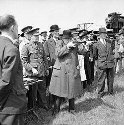 Churchill takes aim with a Sten sub-machine gun in June 1941.