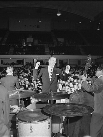 Bandleader Stan Kenton coined "progressive jazz" for his complex, loud, and brassy approach to big band jazz that conveyed an association with art music.[1]