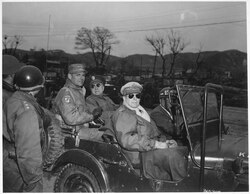 From right to left: MacArthur, Major General Doyle Hickey, and General Matthew Ridgway in a jeep at a UN command post, April 1951, just eight days before MacArthur's removal