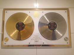 Gold and silver discs issued by EMI in 1982 for Queen's Greatest Hits