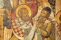Saint Nicholas with Arius at the Council of Nicaea, at which Nicholas is said to have hit Arius; Arius was known for preaching that Jesus was created by God and has a lower status, a heresy in Trinitarianism.