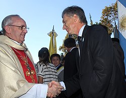 Macri shaking hands with Archbishop Jorge Bergoglio (later Pope Francis)