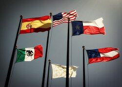 Six different national flags that have flown over Texas; clockwise from top: flag of the United States, flag of Texas, flag of the Confederate States of America, flag of the Kingdom of France, flag of Mexico, and flag of New Spain