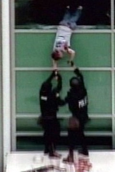 Still image of Ireland shortly before he falls from the library window