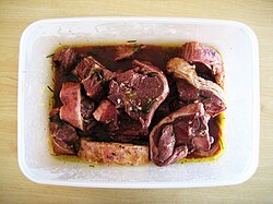 Fatty red meats, such as lamb, pair well with Cabernet Sauvignon due to the ability of proteins and fats to negate some of the tannic qualities of the wine.