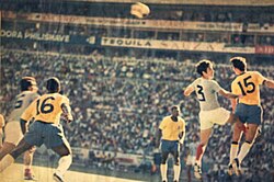 Fontana (yellow 15) and Everaldo (yellow 16) of Brazil playing against Nicolae Lupescu (white 3) and Alexandru Neagu (white 16) of Romania.