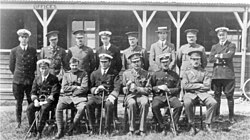 The Central Flying School staff at Upavon Aerodrome in January 1913. Paine is in the front row, shown third from the left.