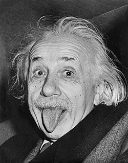 The famous image of Einstein taken by Arthur Sasse in 1951, sitting in a car on his 72nd birthday, having been asked to smile for the camera once again.