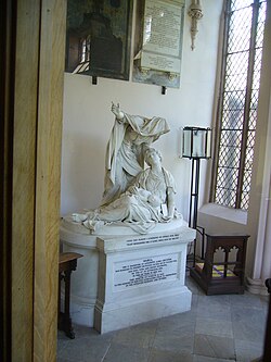 Parish Church: Joseph Nollekens' life-size sculpture of 'Faith' in memory of Henry Howard's wife Maria (who died in childbirth).