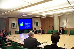 Steven Koonin, BP's Chief Scientist, speaking in the company boardroom in 2005 (top right of picture)