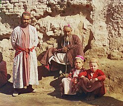 Two Sart men and two Sart boys in Samarkand, c. 1910
