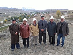 Kyrgyz writer Kenesh Jusupov and General Beishe Moldogaziev with villagers, On-Archain, Naryn Region