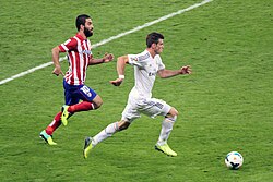 Bale (pictured in 2013) was best known for his pace, athleticism and bending strikes from distance (often using the "knuckleball" technique) in his prime.