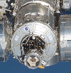 Harmony (center) shown connected to Columbus, Kibo, and Destiny. The dark PMA-2 faces the camera. The nadir and zenith locations are open.