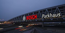 The motorway leading to the airport with a large car park across it