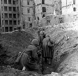 Soviet soldiers running through the ruins of Stalingrad, 1942
