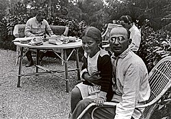 Lavrentiy Beria with Stalin's daughter, Svetlana, on his lap, with Stalin and Nestor Lakoba in the background, 1931
