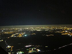 The difference in the amount of aerosols below and above the boundary layer is easy to see in this aerial photograph. Light pollution from the city of Berlin is strongly scattered below the layer, but above the layer it mostly propagates out into space.