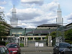 Entrance gates to The National Archives from Ruskin Avenue: the notched vertical elements were inspired by medieval tally sticks.